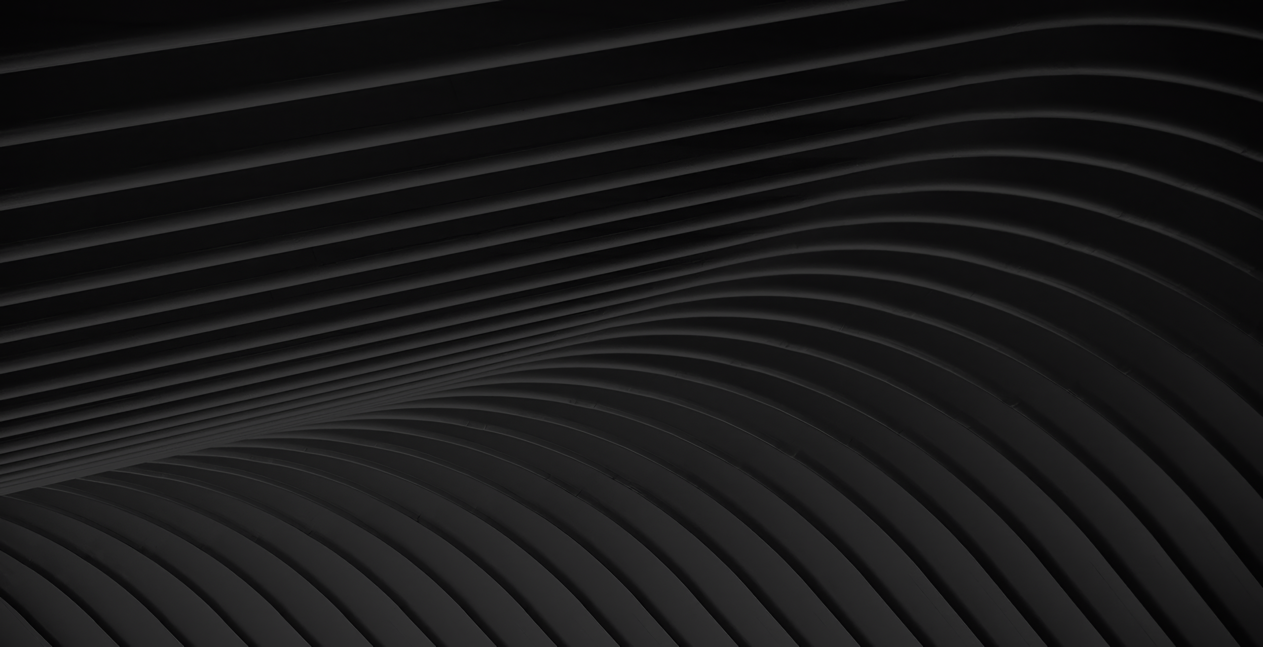 Dark abstract background with flowing, parallel curved lines creating a wave pattern and subtle depth.